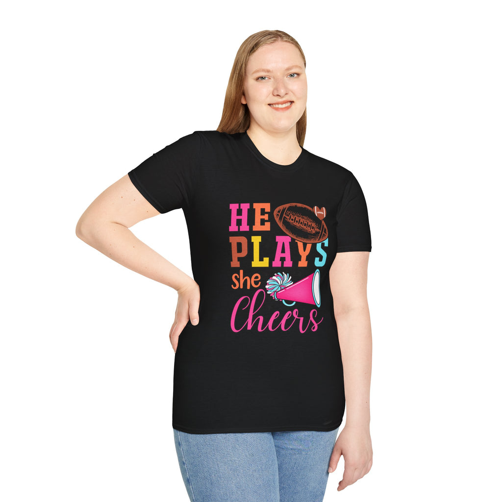 HE PLAYS, SHE CHEERS,  Unisex Softstyle T-Shirt | Supportive Gift for Cheerleading Parents, Sports Events, Game Day Tee